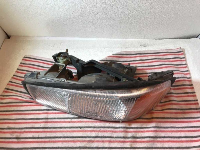 Faro izquierdo usado original (OEM) GMC Sierra 1500 1999-2006