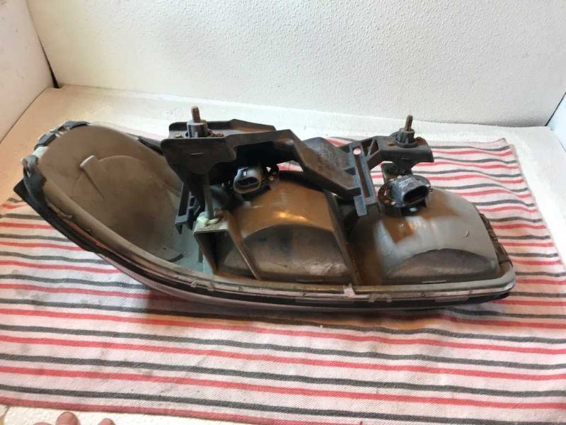 Faro izquierdo usado original (OEM) GMC Sierra 1500 1999-2006
