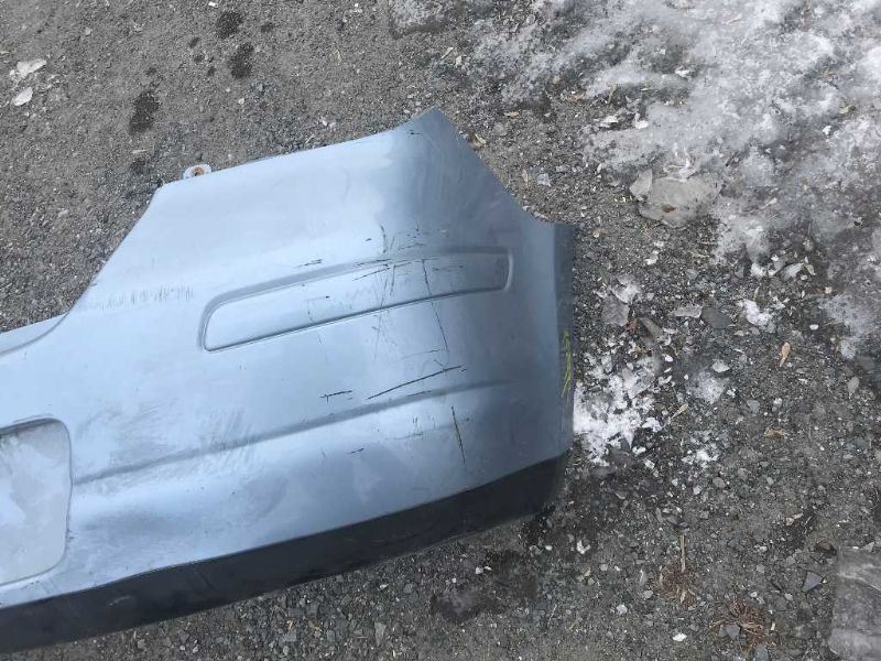 Defensa (parachoques) trasera usada original (OEM) Nissan Versa 2007-2012