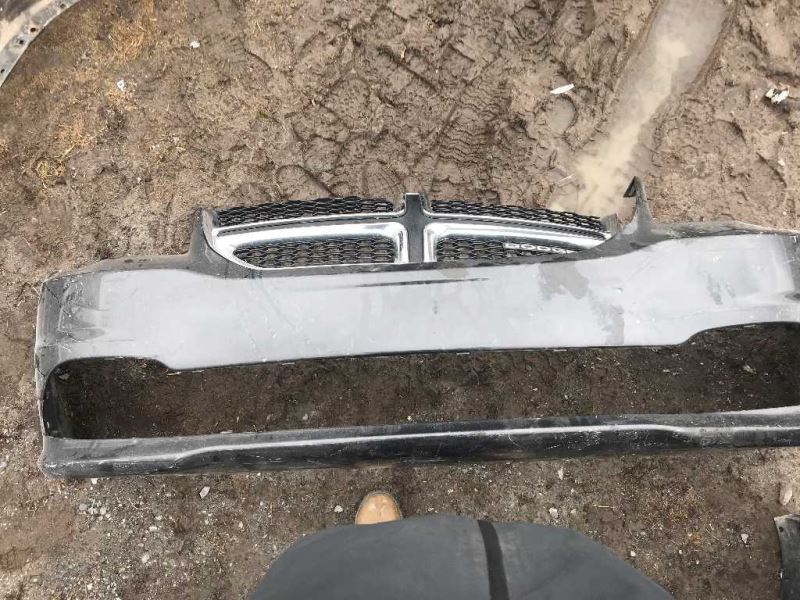 Front bumper cover used genuine OEM Dodge Grand Caravan 2011-2020