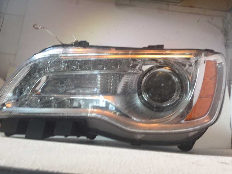 Headlamp Assembly used genuine OEM Chrysler 300 2011-2014