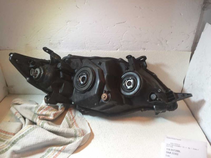 Left headlamp assembly composite used genuine OEM Toyota Corolla 2009-2010