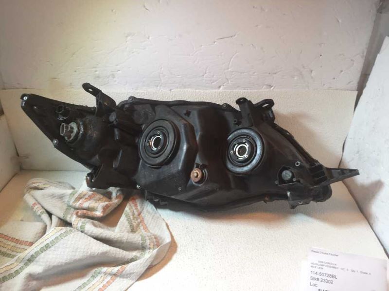 Left headlamp assembly composite used genuine OEM Toyota Corolla 2009-2010