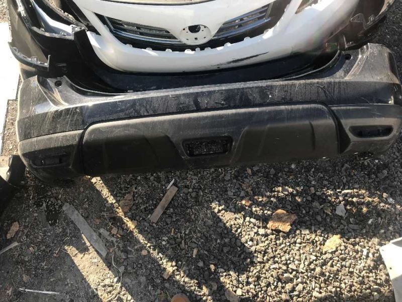Defensa (parachoques) trasera usada original (OEM) Nissan Rogue 2017-2020