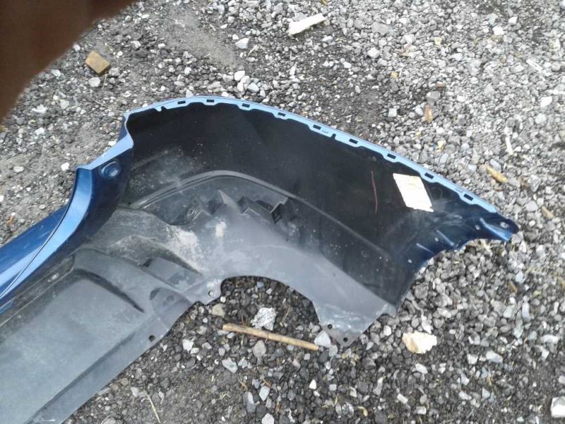 Defensa (parachoques) trasera usada original (OEM) Nissan Rogue 2017-2020