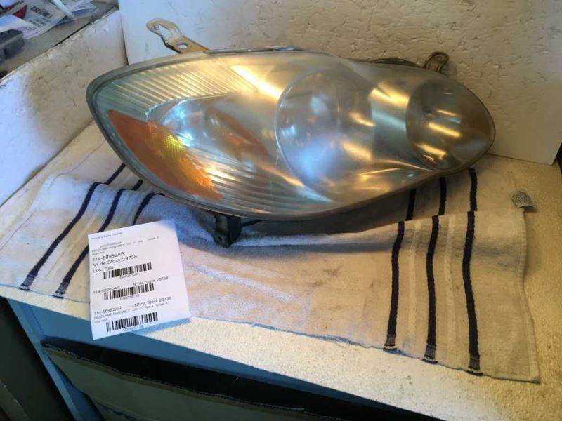 Right headlamp assembly composite used genuine OEM Toyota Corolla 2003-2004
