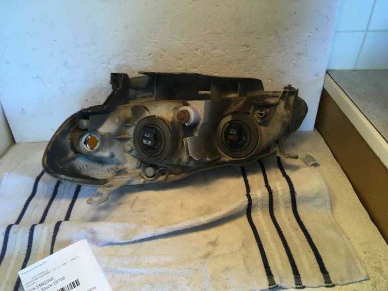 Right headlamp assembly composite used genuine OEM Toyota Corolla 2003-2004
