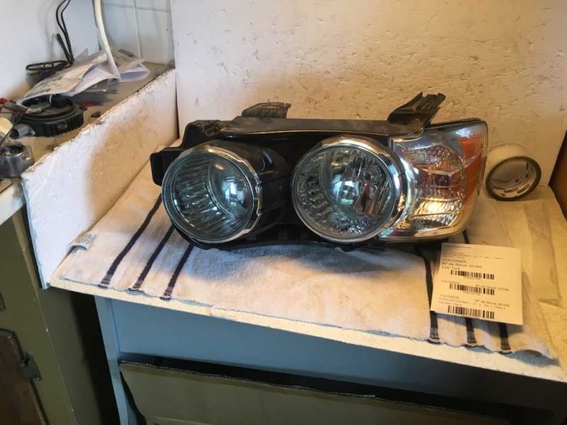 Left headlamp assembly composite used genuine OEM Chevrolet Sonic 2012-2016