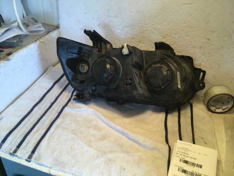 Left headlamp assembly composite used genuine OEM Chevrolet Sonic 2012-2016