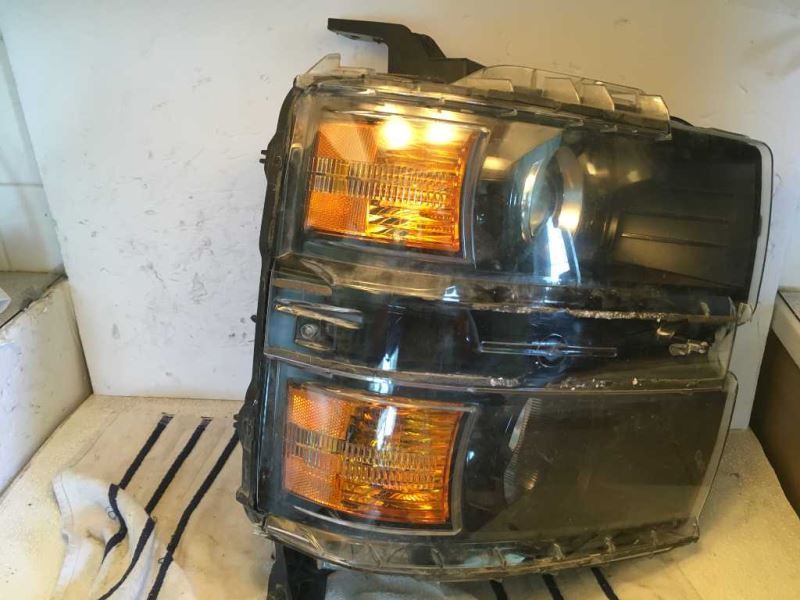 Left headlamp assembly composite used genuine OEM Toyota Corolla 2003-2004