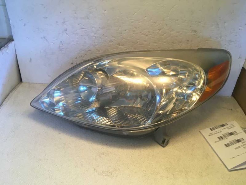 Left headlamp assembly composite used genuine OEM Toyota Matrix 2003-2008