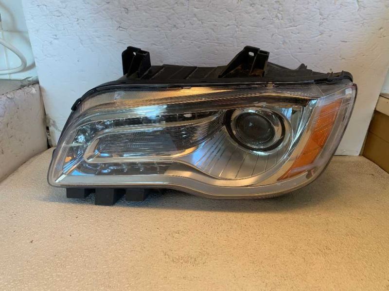 Headlamp Assembly used genuine OEM Chrysler 300 2011-2014