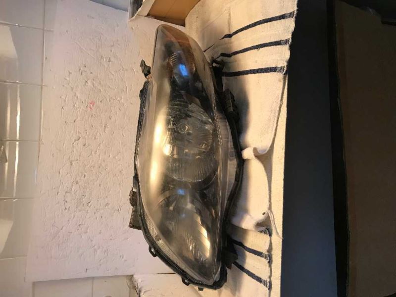 Left headlamp assembly composite used genuine OEM Toyota Corolla 2009-2010