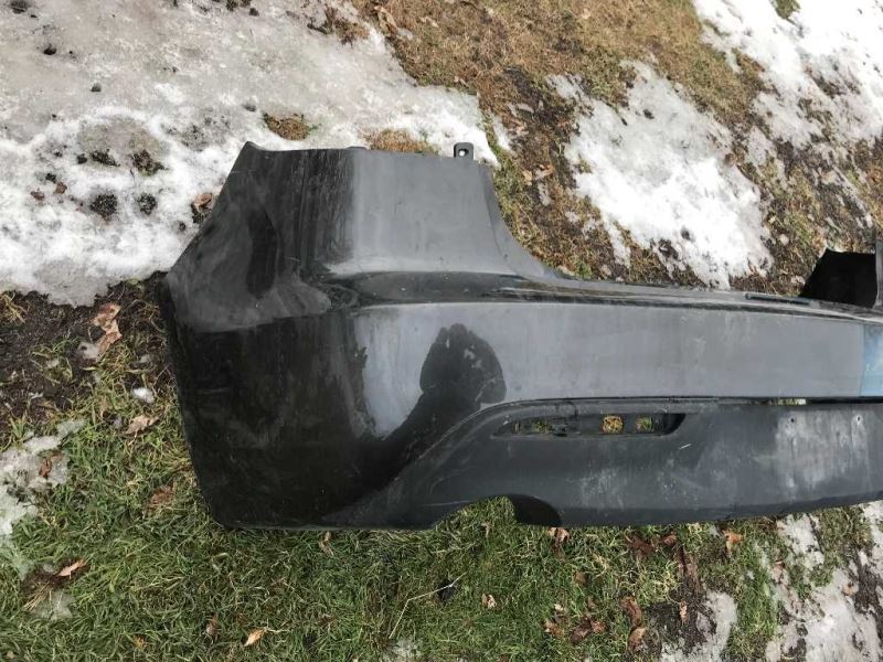 Rear bumper cover used genuine OEM Mazda 3 2010-2011
