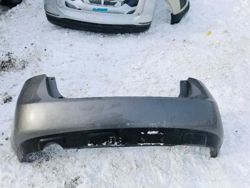 Rear bumper cover used genuine OEM Nissan Rogue 2008-2013