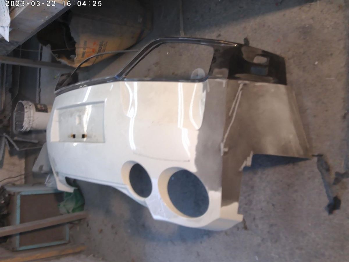 Defensa (parachoques) trasera usada original (OEM) Nissan GT-R 2012-2016