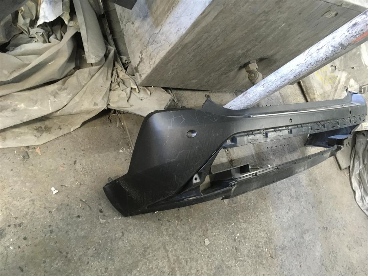 Rear bumper cover used genuine OEM Nissan Rogue 2021-2023