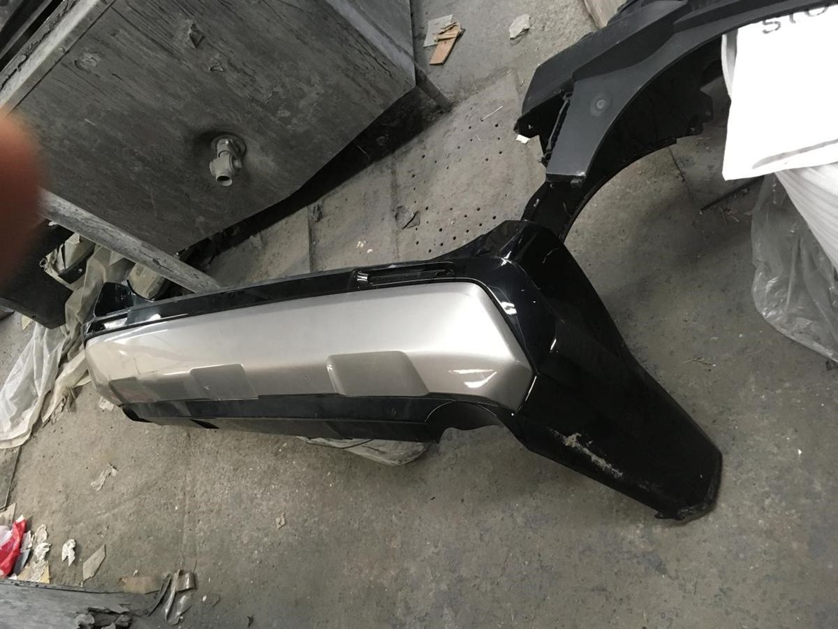 Rear bumper cover used genuine OEM Toyota RAV4 2019-2025