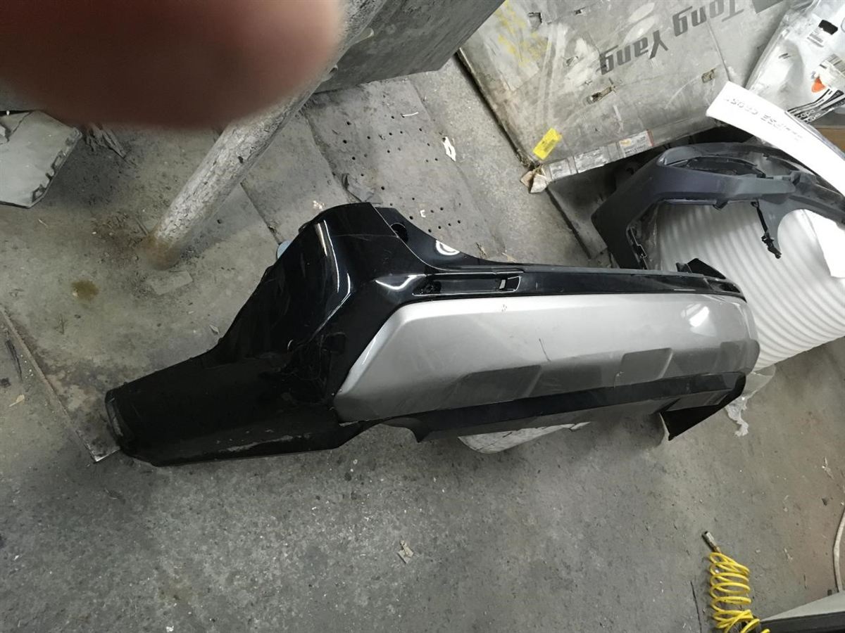 Rear bumper cover used genuine OEM Toyota RAV4 2019-2025