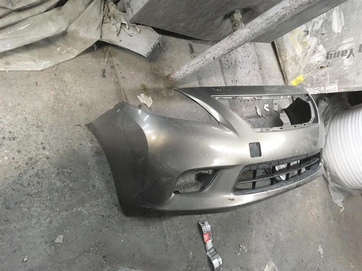 Front bumper cover used genuine OEM Nissan Versa 2013-2014
