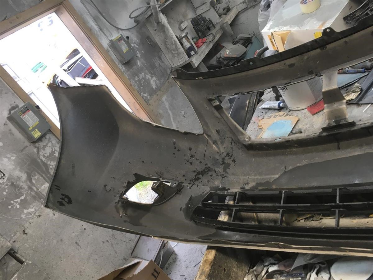 Front bumper cover used genuine OEM Nissan Versa 2013-2014