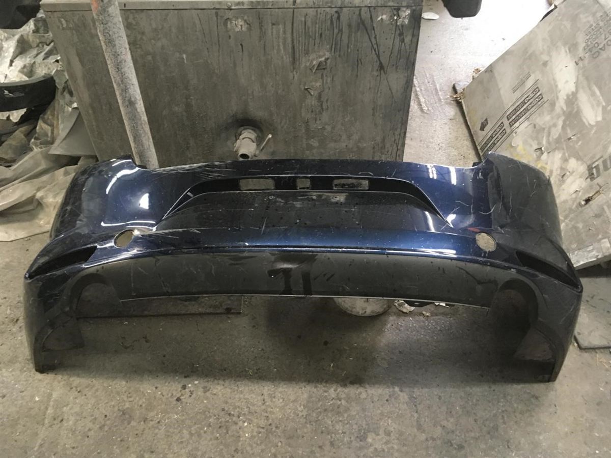 Defensa (parachoques) trasera usada original (OEM) Mazda 3 2019-2025