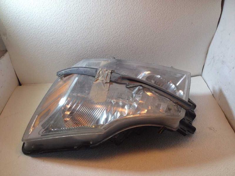 Left headlamp assembly composite used genuine OEM Nissan Armada 2005-2007
